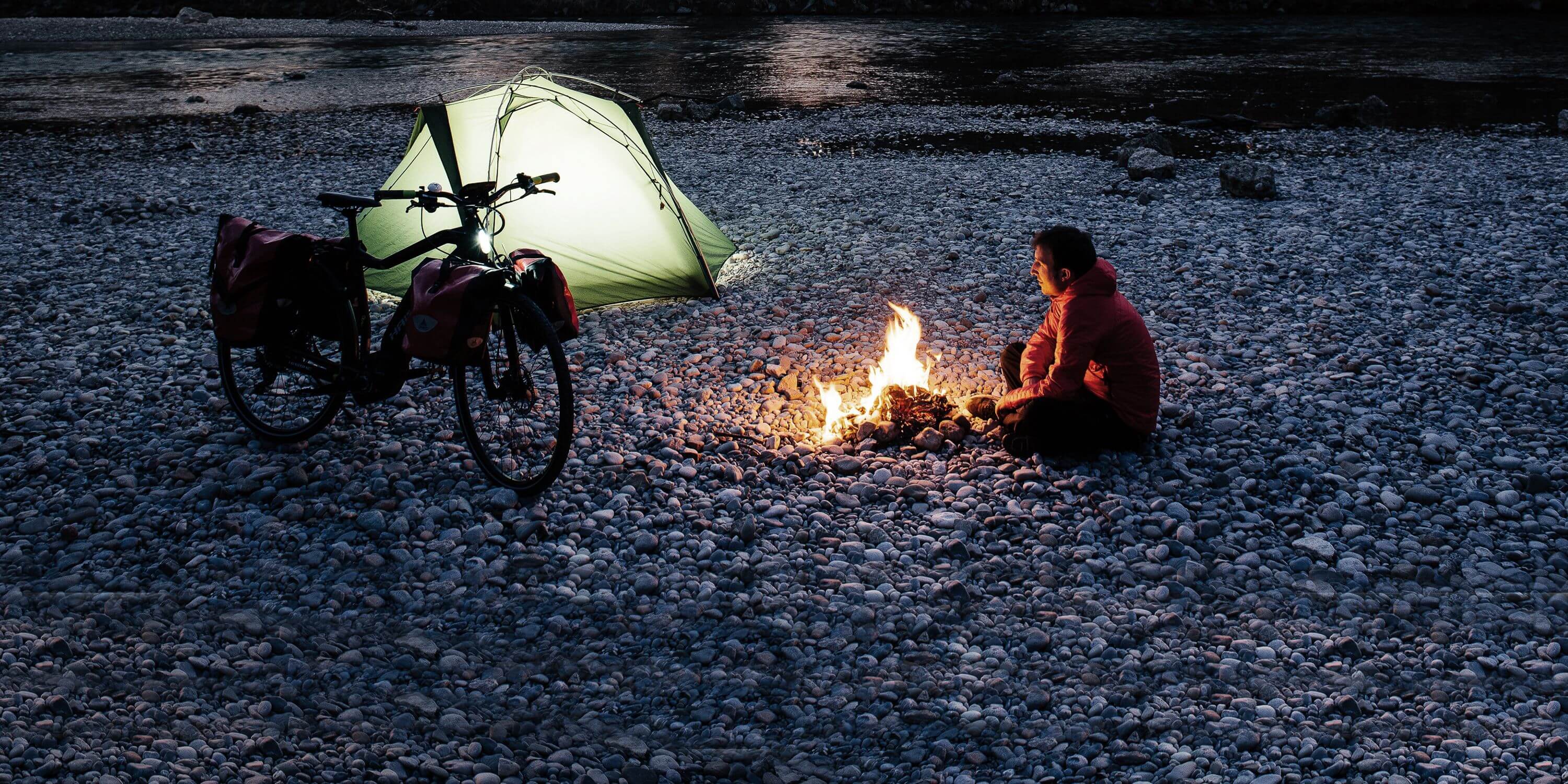 Haibike Hero Maximilian Semsch trekking adventure with tent and campfire
