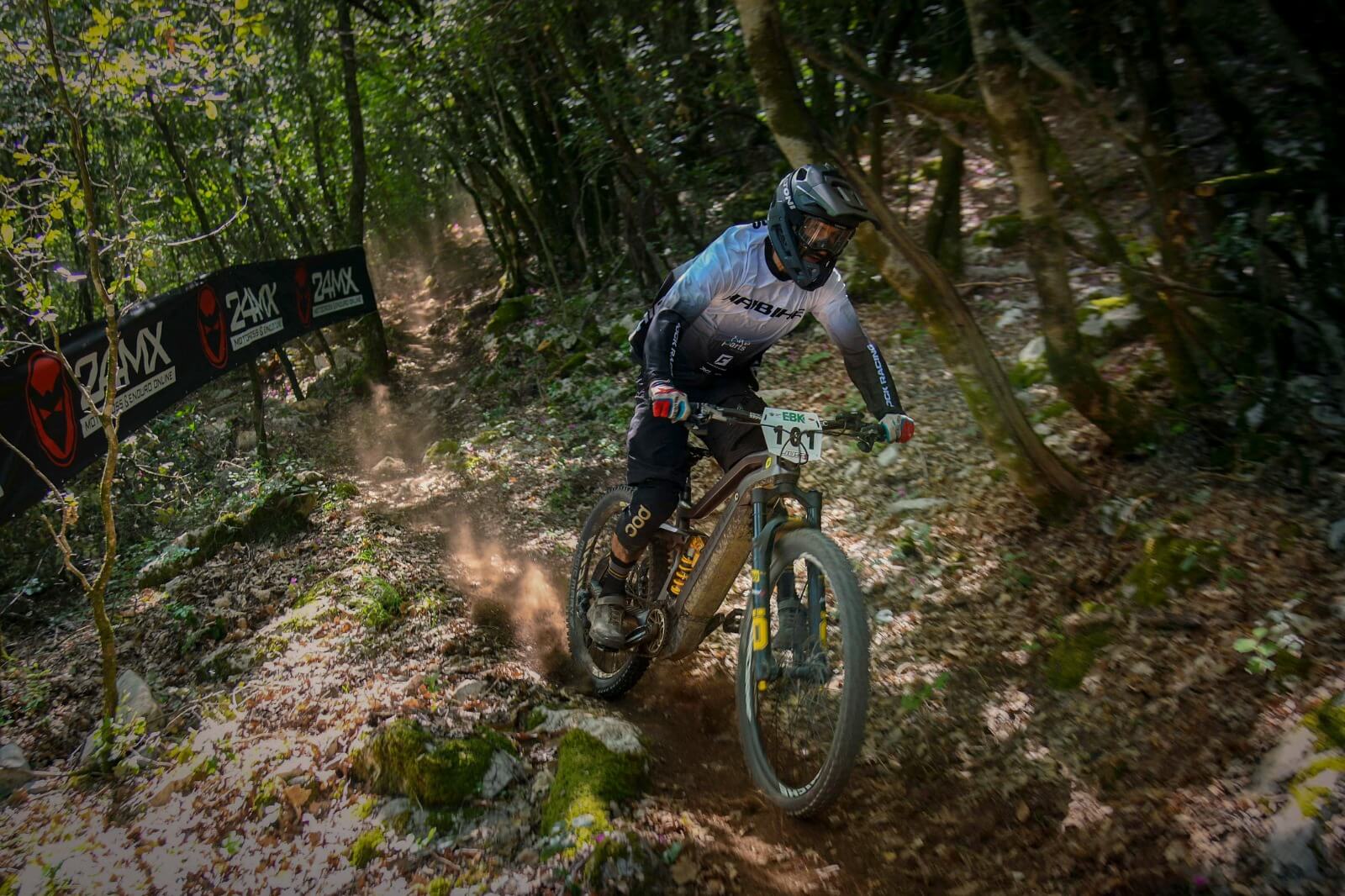 Haibike Hero Andrea Garibbo riding through a forest during the Enduro World Series